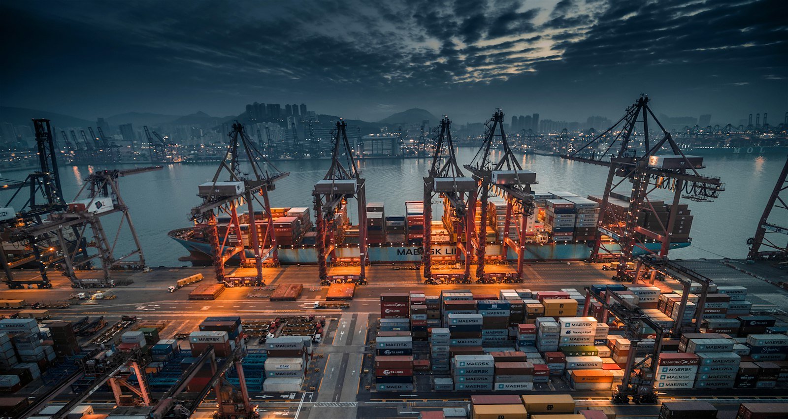 Container ship being loaded at a port
